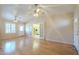 Bright living room with hardwood floors, ceiling fans, and access to kitchen at 1530 E Loma Ln, Phoenix, AZ 85020
