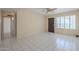 Open living room with tile floors, ceiling fan, and lots of natural light at 1530 E Loma Ln, Phoenix, AZ 85020