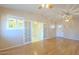 Inviting living room with hardwood floors, access to kitchen, and bright windows at 1530 E Loma Ln, Phoenix, AZ 85020