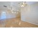 Hardwood floor living room with bright light from windows at 1530 E Loma Ln, Phoenix, AZ 85020