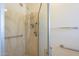Accessible shower with grab bars and a handheld showerhead at 1530 E Loma Ln, Phoenix, AZ 85020