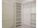 Organized walk-in closet with built-in shelving and ample storage space at 1530 E Loma Ln, Phoenix, AZ 85020