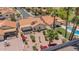 Aerial view of a Southwestern-style home with a refreshing pool and mature landscaping in a well-kept neighborhood at 1549 N La Rosa Dr, Tempe, AZ 85288