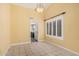 Bright dining room features tile floors, and a view of the kitchen, with a view of the outdoors at 1549 N La Rosa Dr, Tempe, AZ 85288