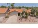 Charming single-story home with a spacious driveway and desert landscaping for low-maintenance appeal at 1549 N La Rosa Dr, Tempe, AZ 85288