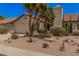 Charming home featuring a xeriscaped front yard with desert plants and a neutral color palette at 1549 N La Rosa Dr, Tempe, AZ 85288