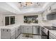 The kitchen features ample counter space, stainless steel appliances, and a view of the backyard and patio at 1549 N La Rosa Dr, Tempe, AZ 85288
