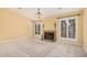 Inviting living room with tile flooring, fireplace and shutters for an abundance of natural light at 1549 N La Rosa Dr, Tempe, AZ 85288
