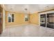Open living room with natural light from the sliding glass doors and windows at 1549 N La Rosa Dr, Tempe, AZ 85288