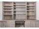 Office features built-in cabinets and desk with a pull out keyboard tray at 1549 N La Rosa Dr, Tempe, AZ 85288