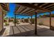 Charming covered patio with desert landscaping, perfect for enjoying the outdoors in comfort and style at 1549 N La Rosa Dr, Tempe, AZ 85288