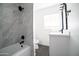 Modern bathroom with tiled shower, new vanity, and contemporary fixtures at 1721 W Earll Dr, Phoenix, AZ 85015
