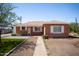 Charming brick home featuring updated landscaping and a well-manicured front yard at 1721 W Earll Dr, Phoenix, AZ 85015