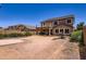 Large backyard with a concrete pad, block wall fencing, and potential for outdoor entertaining and customization at 18182 W Desert Ln, Surprise, AZ 85388