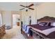 Spacious main bedroom with a decorative bed frame and an ensuite bathroom, creating a peaceful retreat at 18182 W Desert Ln, Surprise, AZ 85388
