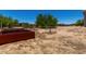 Flat desert lot featuring gardening boxes and native vegetation at 19621 W Minnezona Ave, Litchfield Park, AZ 85340