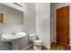 Bathroom with a pedestal sink and toilet at 19621 W Minnezona Ave, Litchfield Park, AZ 85340