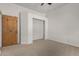 Bedroom featuring a closet, carpeted floor, and a ceiling fan at 19621 W Minnezona Ave, Litchfield Park, AZ 85340