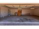Spacious two car garage with ample storage space and utility connections at 19621 W Minnezona Ave, Litchfield Park, AZ 85340