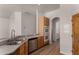 Kitchen area showcasing wood cabinets and stainless steel appliances at 19621 W Minnezona Ave, Litchfield Park, AZ 85340