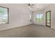 A bright primary bedroom with natural light and carpeted floors at 19621 W Minnezona Ave, Litchfield Park, AZ 85340
