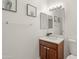 Cozy bathroom with a wood vanity, white counter, and decorative mirror, creating an inviting space at 2150 E Bell Rd # 1088, Phoenix, AZ 85022