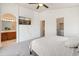 Bright bedroom featuring a TV, attached bath and closet, offering comfort and convenience at 2150 E Bell Rd # 1088, Phoenix, AZ 85022