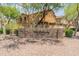 Inviting property entrance with stone signage and beautifully landscaped surroundings at 2150 E Bell Rd # 1088, Phoenix, AZ 85022