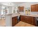 Well-lit kitchen with wooden cabinets and stainless steel appliances at 2150 E Bell Rd # 1088, Phoenix, AZ 85022