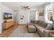 Comfortable living room features a large sectional couch, light walls and bright windows at 2150 E Bell Rd # 1088, Phoenix, AZ 85022