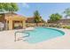 Community pool with inviting blue water and covered gazebo at 2150 E Bell Rd # 1088, Phoenix, AZ 85022