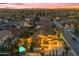 Aerial view of a charming neighborhood with a home featuring a private pool and lush landscaping at 21575 E Twin Acres Ct, Queen Creek, AZ 85142