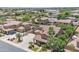 Stunning aerial shot showcasing a home with a sports court, pool, and well-manicured desert landscaping at 21575 E Twin Acres Ct, Queen Creek, AZ 85142