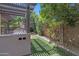 Backyard view of the barbecue area, patio, and trellis at 21575 E Twin Acres Ct, Queen Creek, AZ 85142
