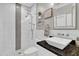 Bright bathroom with marble tiling, glass shower, decorative shelves, and a modern vanity with a vessel sink at 21575 E Twin Acres Ct, Queen Creek, AZ 85142