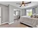 Bright bedroom featuring a mirrored closet and ample natural light at 21575 E Twin Acres Ct, Queen Creek, AZ 85142