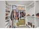 Spacious walk-in closet with custom shelving and ample storage space at 21575 E Twin Acres Ct, Queen Creek, AZ 85142