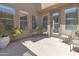 Inviting outdoor courtyard perfect for relaxing, complete with comfortable seating and potted plants at 21575 E Twin Acres Ct, Queen Creek, AZ 85142