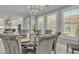 Cozy dining room with seating for six, chandelier, and natural light at 21575 E Twin Acres Ct, Queen Creek, AZ 85142