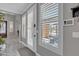 Bright entryway featuring shuttered windows providing a view of the well landscaped front yard at 21575 E Twin Acres Ct, Queen Creek, AZ 85142