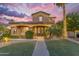 Beautiful two-story home with well-maintained landscaping and charming curb appeal, perfect for a welcoming Gathering at 21575 E Twin Acres Ct, Queen Creek, AZ 85142
