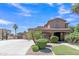Attractive home with a well-maintained lawn, lush landscaping, and a long driveway at 21575 E Twin Acres Ct, Queen Creek, AZ 85142