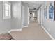 Hallway featuring modern blue artwork and several doors at 21575 E Twin Acres Ct, Queen Creek, AZ 85142