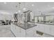 Stylish kitchen island with pendant lighting, marble countertops, and ample storage space at 21575 E Twin Acres Ct, Queen Creek, AZ 85142