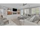 Open-concept living room showcasing a fireplace and access to the kitchen at 21575 E Twin Acres Ct, Queen Creek, AZ 85142