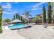 Backyard oasis with a sparkling pool, spa, and lush landscaping, creating a perfect retreat for relaxation and recreation at 21575 E Twin Acres Ct, Queen Creek, AZ 85142