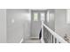 Carpeted staircase featuring white railing and trimmed windows at 21575 E Twin Acres Ct, Queen Creek, AZ 85142