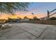 Outdoor basketball court provides ample space, a picnic table, and perimeter lighting at 22039 N 86Th Ave, Peoria, AZ 85383