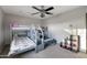 Bedroom with bunkbeds and a ceiling fan at 22039 N 86Th Ave, Peoria, AZ 85383