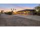 Three car garage with extra long driveway in front of custom home at 22039 N 86Th Ave, Peoria, AZ 85383